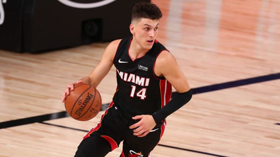 Sep 19, 2020; Lake Buena Vista, Florida, USA; Miami Heat guard Tyler Herro (14) brings the ball up court against the Boston Celtics during the first half of game three of the Eastern Conference Finals of the 2020 NBA Playoffs at ESPN Wide World of Sports Complex. Mandatory Credit: Kim Klement-USA TODAY Sports